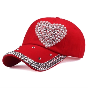 Red baseball cap for women with heart shaped pearls and rhinestone studded brim
