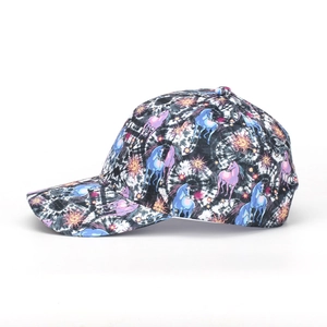 Detail of tie-dye baseball cap with colorful unicorn and tropical star print patterns
