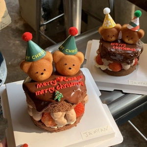 Mini Christmas chocolate strawberry cake decorated with bears wearing Merry Christmas hats