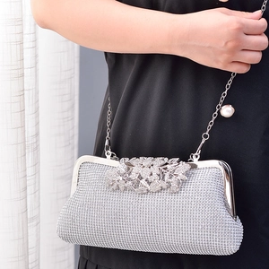 Silver luxury evening clutch bag with sparkling rhinestones and crystal leaf clasp