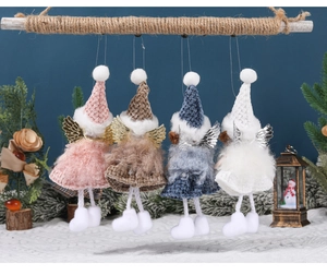 Detail of four handmade Christmas angel doll ornaments with sequin wings and fur skirts