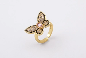 Macro shot of 18K gold butterfly ring with pink marquise stone and colorful zircon pavé