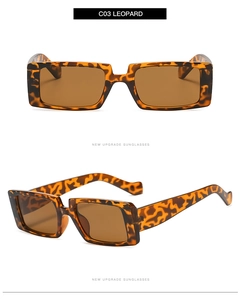 Detail view of leopard print square sunglasses featuring dark brown lenses and thick frames