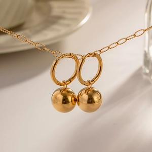 Women's 18K gold stainless steel hoop earrings with sphere pendant in minimalist style