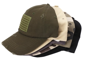 Detail of distressed baseball caps with American flag embroidery in multiple colors