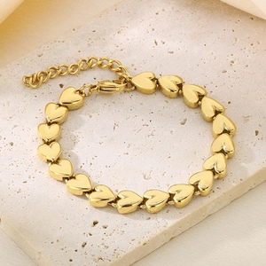 Detail showing high-quality gold 3D heart-shaped links and adjustable lobster clasp