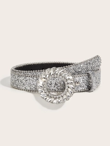 Macro shot of silver glitter belt with a large circular crystal buckle and beaded edges