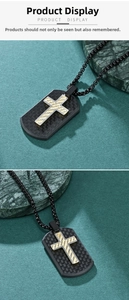 Detail of cross dog tag pendant with carbon fiber texture and silver gold accents