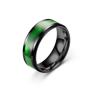 Detailed view of a black titanium steel ring with an elegant green marbled inlay