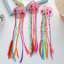 Three sets of colorful braided hair extensions for girls on pink polka dot cloud cards