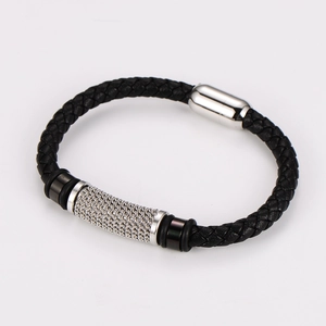 Detail of black braided leather bracelet with silver stainless steel mesh accents and magnetic clasp
