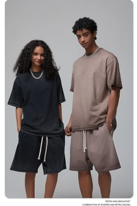 Detail of oversized washed cotton t-shirt and shorts set with retro street style texture
