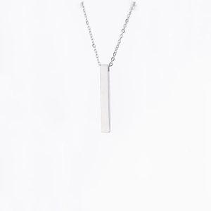 Detailed view of a silver vertical rectangular bar necklace with a polished mirror finish