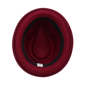 Detail view of the wine red felt hat interior with 35% cotton 65% polyester material label