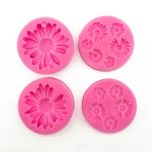 Detailed view of pink silicone daisy flower molds for cake baking and DIY resin crafts