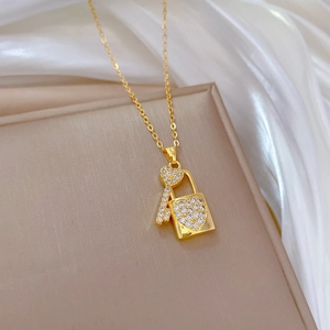 Titanium steel heart lock and key pendant necklace with sparkling zircons on silk