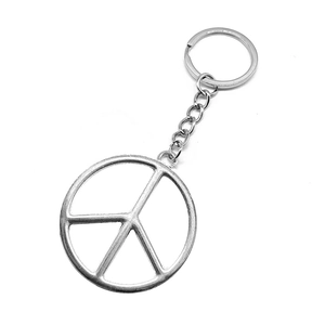 Silver peace symbol metal keychain with short chain and ring on white background