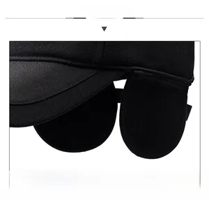 Detail of winter baseball cap featuring thick ear flaps and durable twill stitching