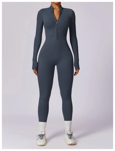 Close-up of slate blue long sleeve yoga bodysuit featuring a high-neck zipper design