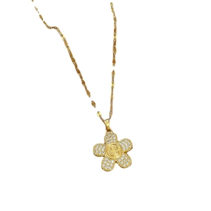 Gold titanium steel flower necklace with sparkling rhinestones and a central smiley face
