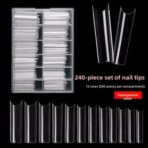 Macro detail of 240pcs clear C-curve long coffin false nails in a 12-size storage box