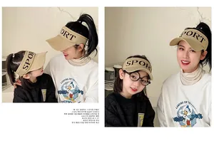Detail of beige knit visor hat with SPORT letter embroidery in a mother and daughter set
