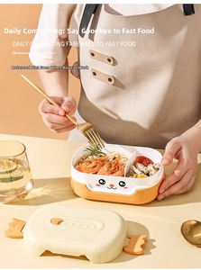 Detail of cartoon lunch box with orange latches and divided compartments for students
