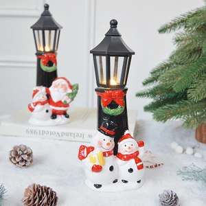 Christmas street lamp table ornament featuring Santa Claus and snowman figures