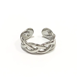 Close-up of polished silver stainless steel woven chain ring with adjustable open band