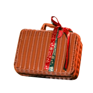 Brown woven rattan gift suitcase with a festive red and green Merry Christmas ribbon