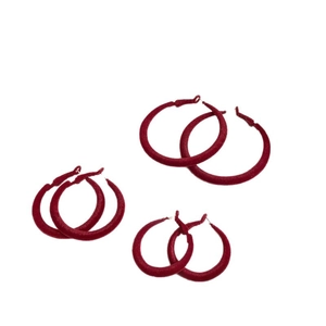 Three pairs of elegant red flocked hoop earrings with a velvet texture on a white background