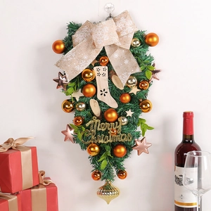 Festive Christmas teardrop swag decoration with gold balls and burlap snowflake bow
