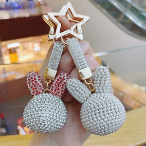 Sparkling crystal rabbit keychain with white pearl beads and gold star charm for handbags