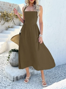 Detail of a dark brown halter neck maxi dress with a flattering high waist design