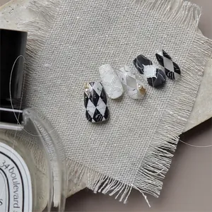 Embossed nail art stickers with marble texture, checkers, and pearl accents