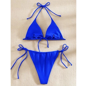 Detail of bright blue triangle bikini top with adjustable drawstring and side-tie bottom
