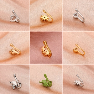 9-piece set of gold and silver non-pierced copper nose cuffs with butterfly and star shapes