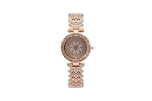 Detail of rose gold ladies watch featuring rhinestone flower dial and hollowed bracelet