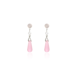 Detail of pink teardrop pearl earrings with silver butterfly tassels on white background