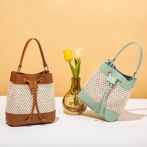 Fashionable woven bucket bags in brown and green with drawstring and metal ring