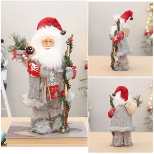 Detailed multi-angle views of a 12-inch Santa doll with gray faux fur and gift bag