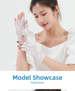 Close-up of white lace fingerless gloves with delicate floral hollow patterns for women
