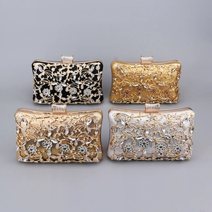 Detail view of four diamond-studded evening clutch bags in black, gold, rose gold and silver