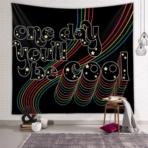 Bohemian rainbow tapestry on white brick wall with one day you'll be cool text