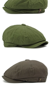 Detail of vintage newsboy caps showing cotton fabric texture and leather strap accents