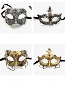 Detail view of retro punk half-face masks with chains and studs in gold and silver