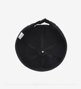Detail view of the breathable 100% polyester inner lining of the black Docker cap