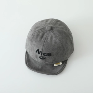 Close-up of grey suede baby baseball cap with embroidered Nice smiley face and soft brim