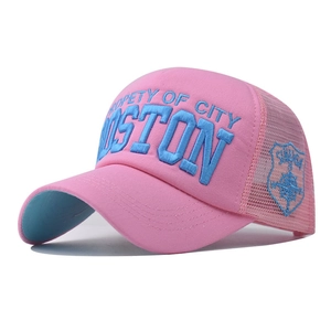 Detail of pink mesh trucker hat with blue Boston embroidery and side shield patch