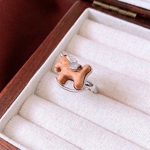 Silver rocking horse ring with wood inlay and cubic zirconia on jewelry box